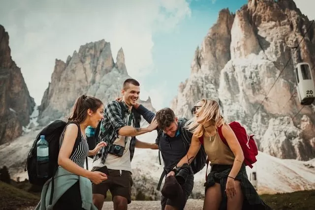Image of Who's Most Likely to questions for friends Friends hiking under Who's Most Likely to questions for friends